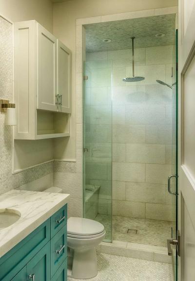 Guest bath with marble vanity and rain-shower fixtures