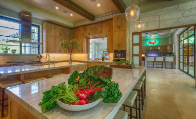 Chef's kitchen — twin islands, white oak cabinetry, quartzite tops