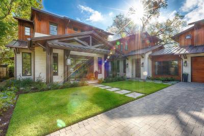 Covered front porch with limestone columns and cedar gables