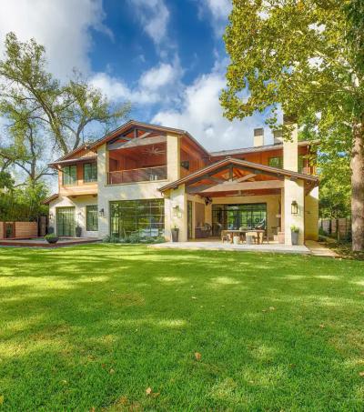 Rear elevation — limestone, cedar, and standing-seam metal roof
