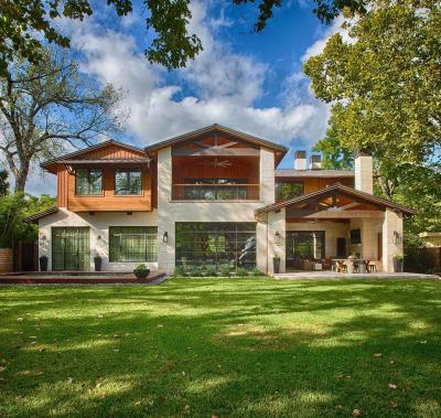 Backyard elevation with covered outdoor living and dining