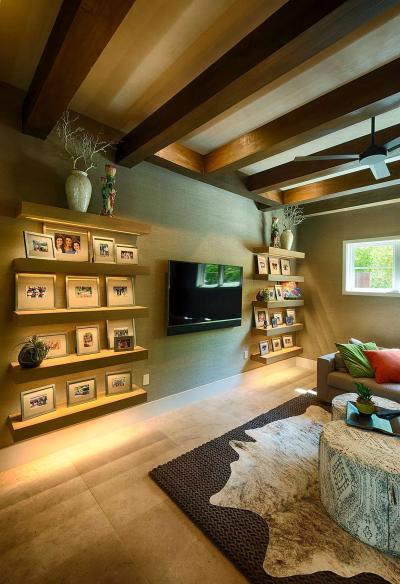Media room with backlit picture ledges and exposed beams