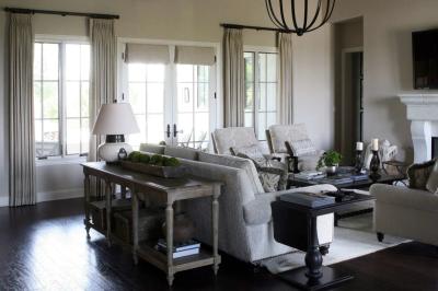 Adjacent living room with limestone fireplace and french doors